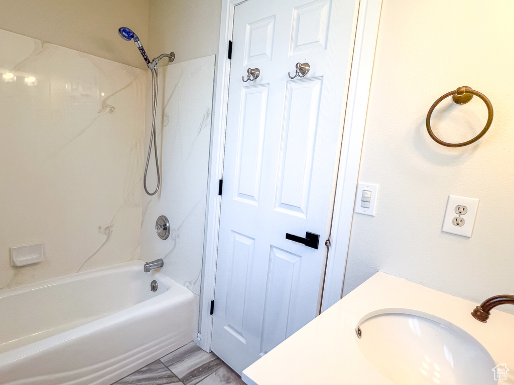 Full bath with washtub / shower combination and vanity