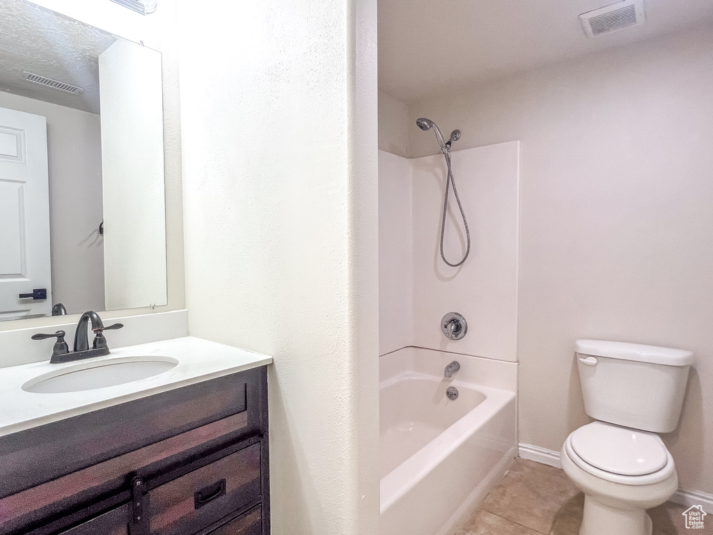 Full bathroom with tile patterned flooring, vanity, and shower / tub combination