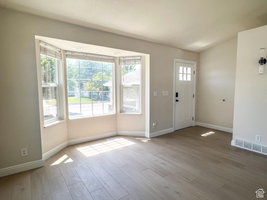 Entryway featuring wood finished floors and baseboards