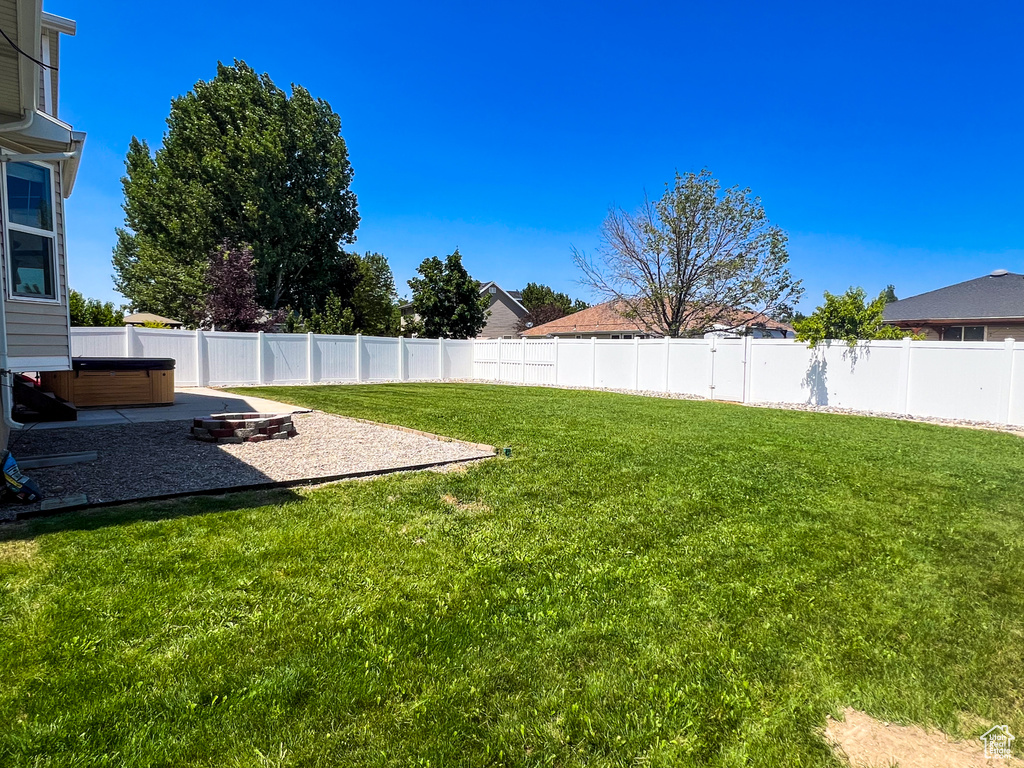 Fenced yard featuring a patio area