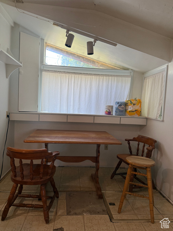 Dining room with lofted ceiling