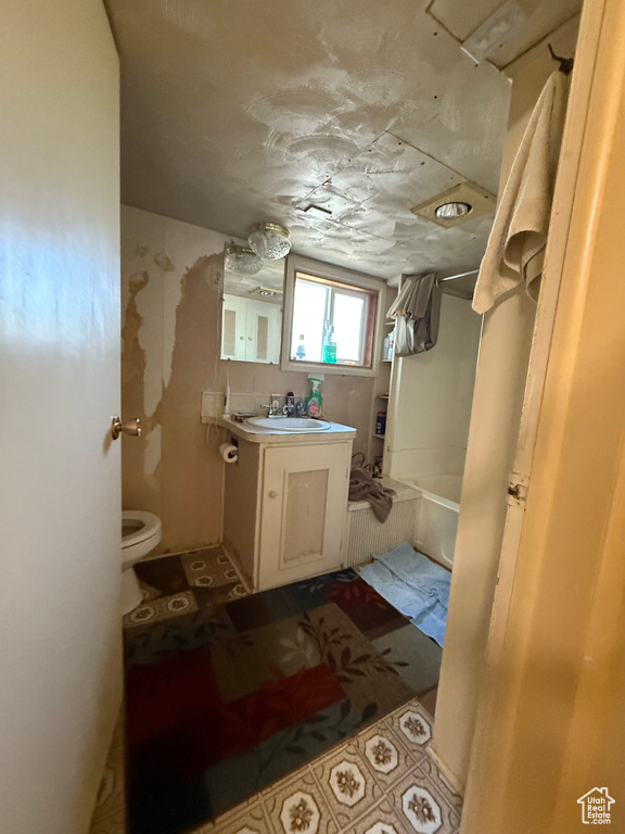Full bathroom with vanity and a tub