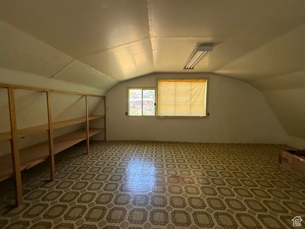 Additional living space featuring lofted ceiling