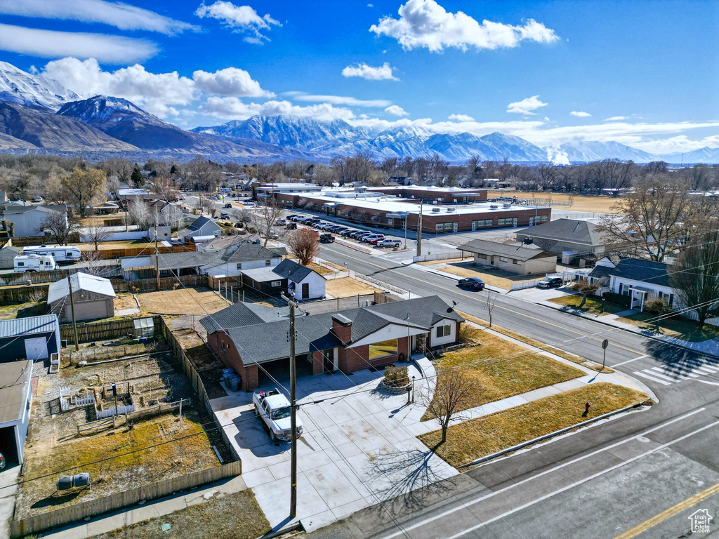 Aerial perspective of suburban area with a mountainous background