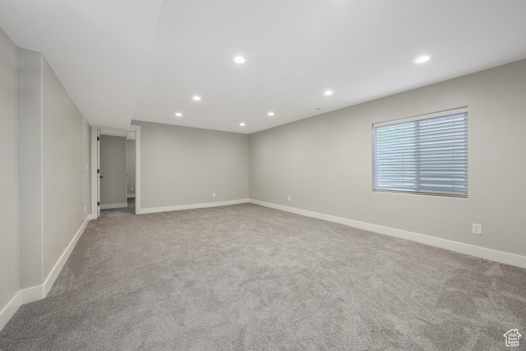 Unfurnished room featuring recessed lighting and carpet flooring