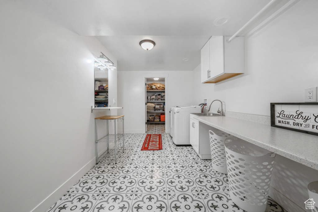 Laundry room featuring cabinet space and washing machine and dryer