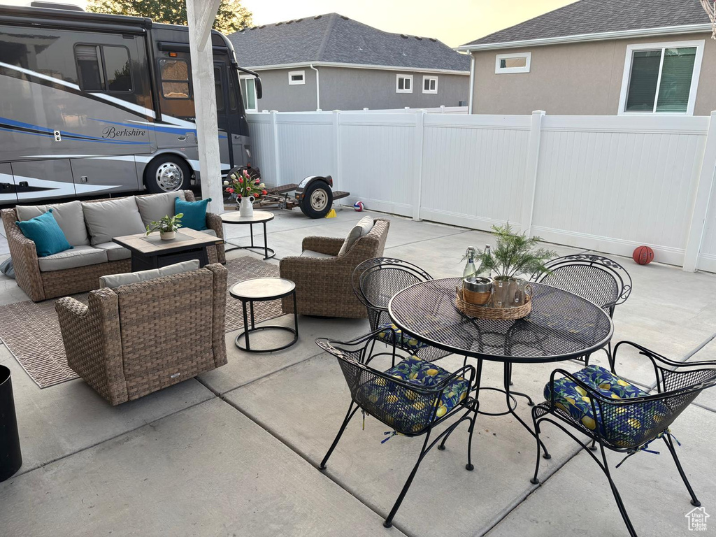 View of patio with an outdoor hangout area