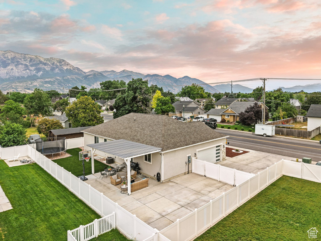 View of mountain backdrop featuring nearby suburban area