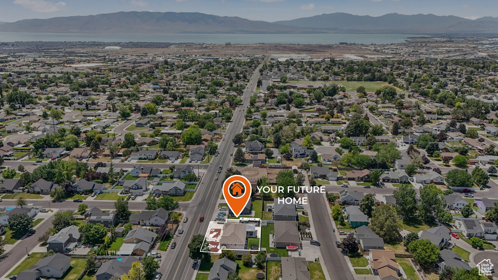 Aerial view of property\'s location featuring mountains and nearby suburban area