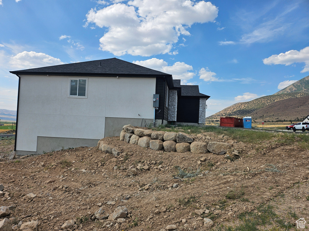 Back of property featuring a mountain view
