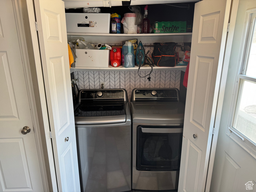 Laundry area featuring separate washer and dryer