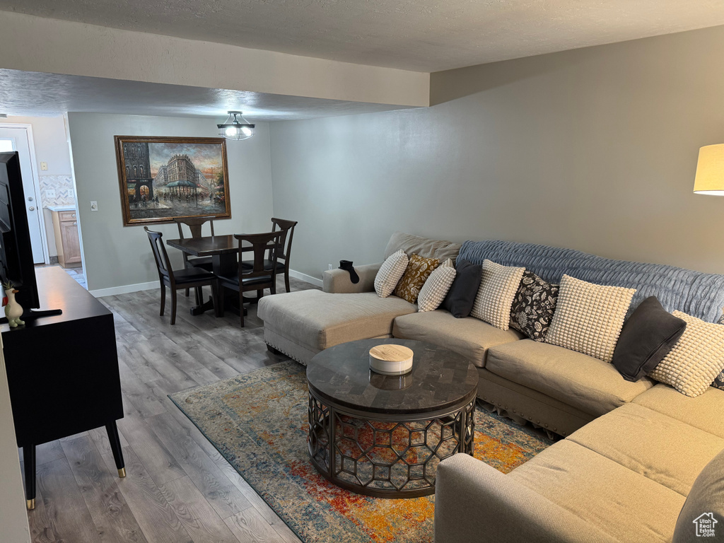 Living area featuring wood finished floors and baseboards