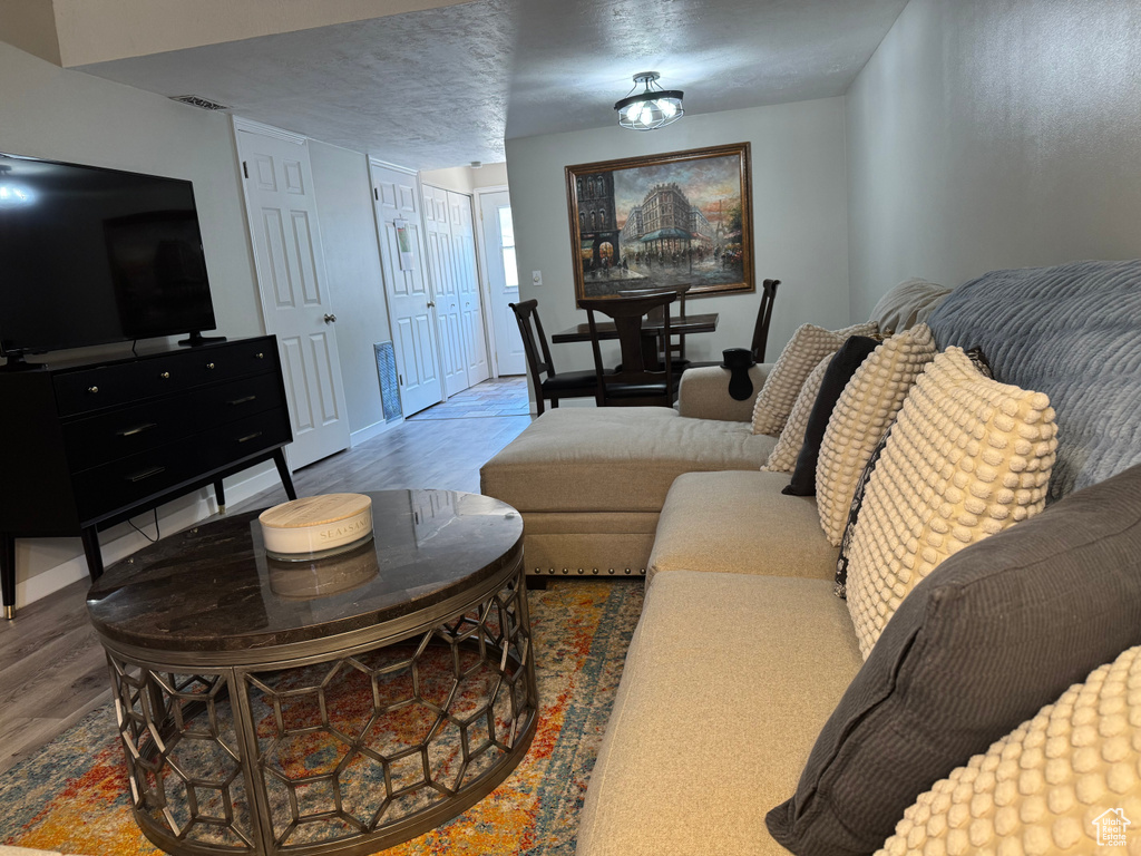 Living area featuring wood finished floors and baseboards
