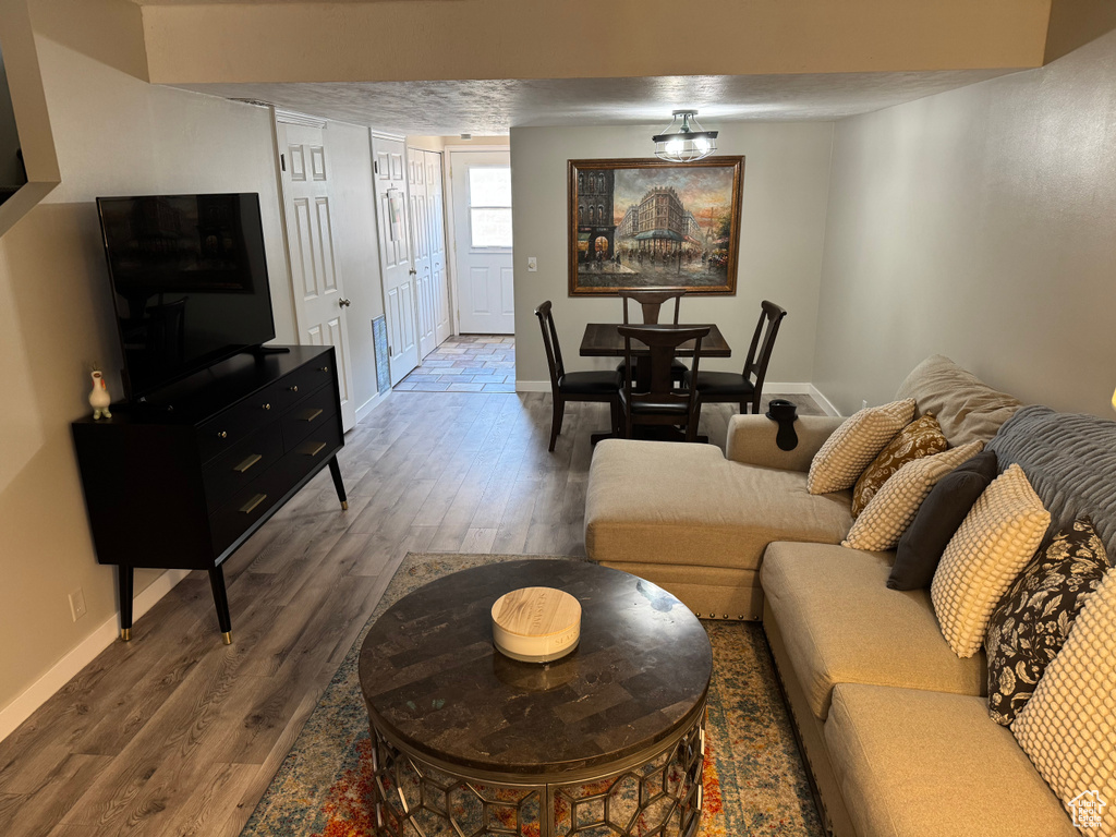 Living room with wood finished floors and baseboards