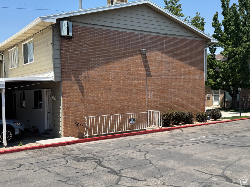 View of side of property with brick siding