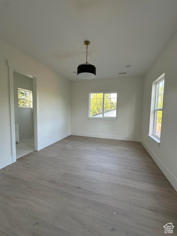 Spare room featuring wood finished floors