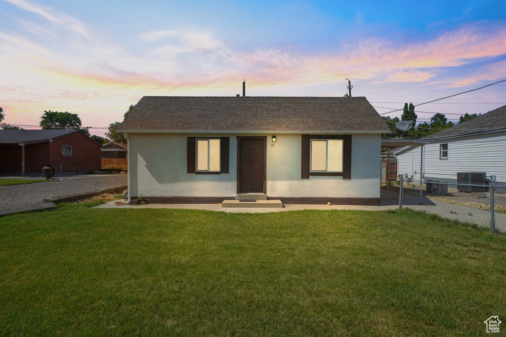 View of front of property featuring stucco siding, roof with shingles, and entry steps