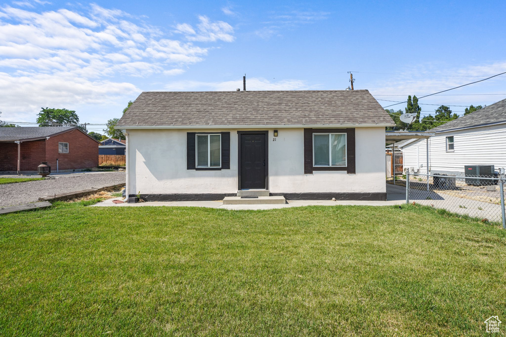 View of front of home featuring stucco siding, entry steps, and roof with shingles
