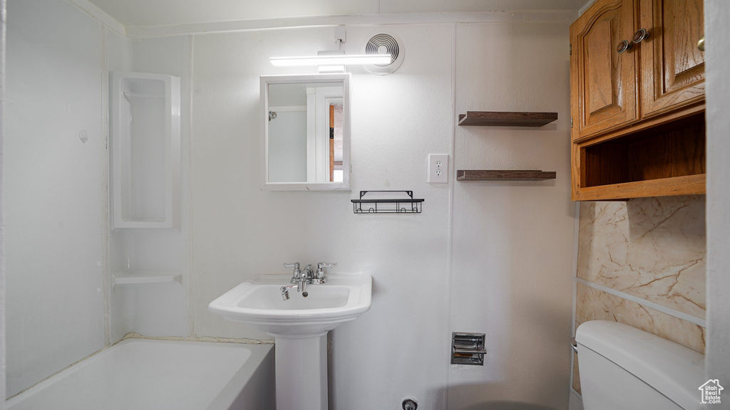 Full bath with toilet and tub / shower combination