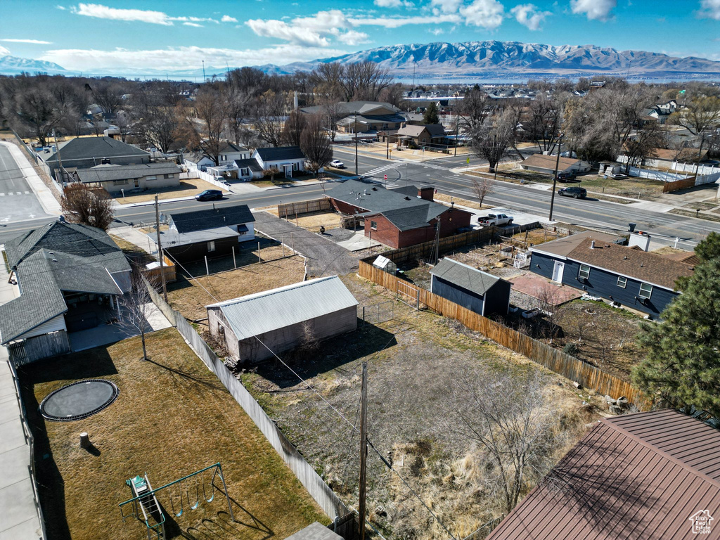Aerial perspective of suburban area featuring a mountainous background