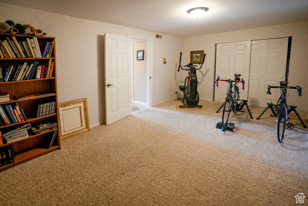 Workout room with carpet flooring