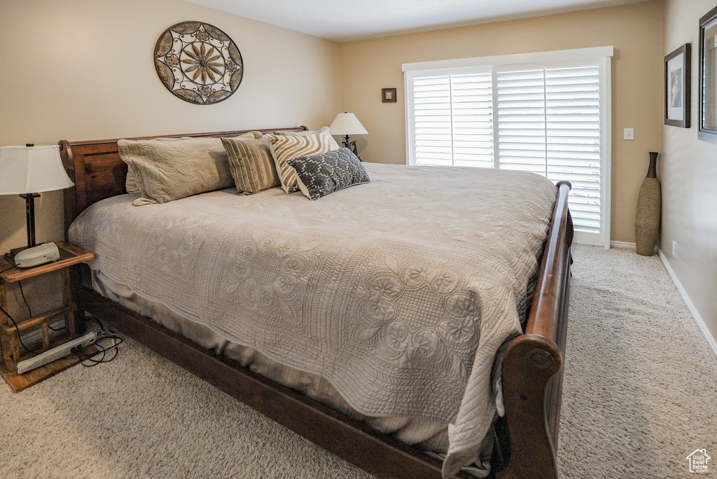Bedroom with carpet flooring and baseboards