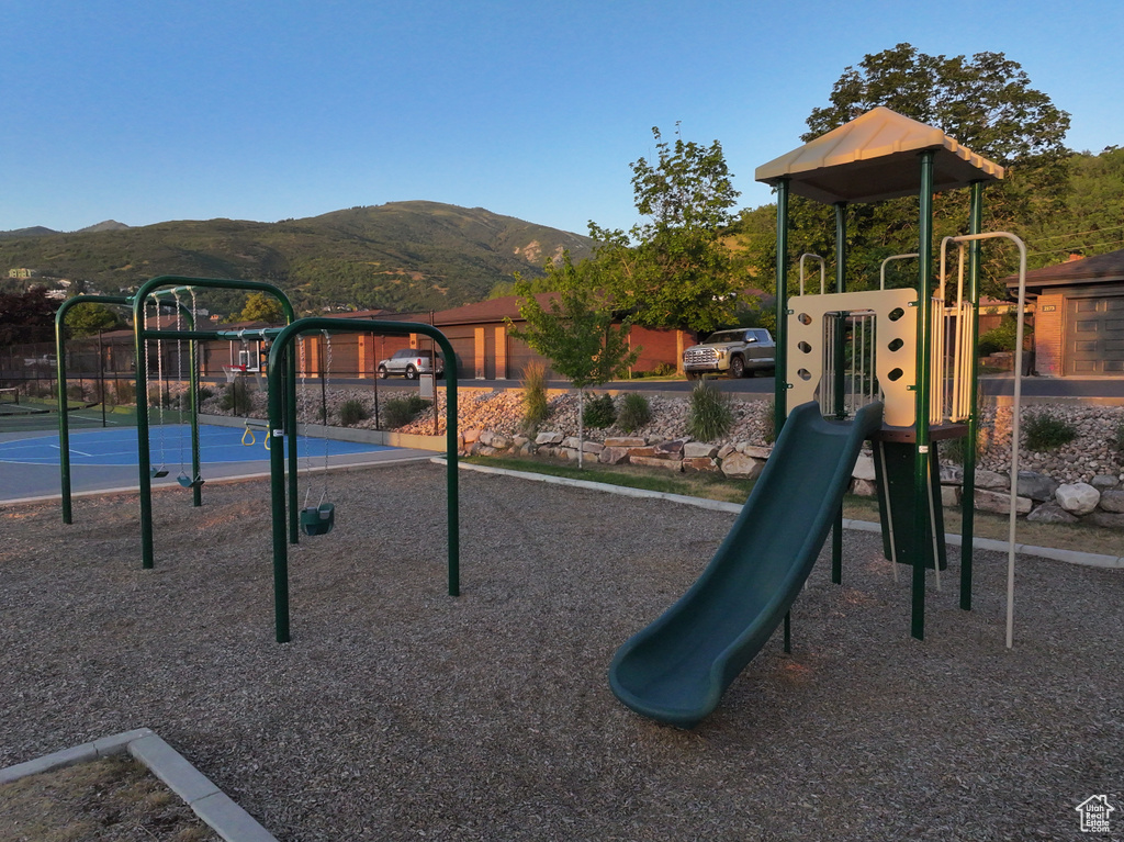 Community jungle gym featuring a mountain view