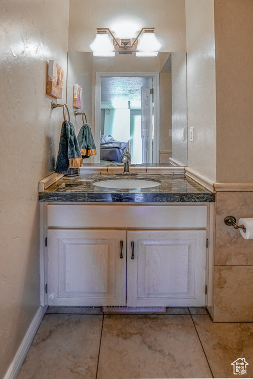 Bathroom featuring vanity and tile patterned flooring