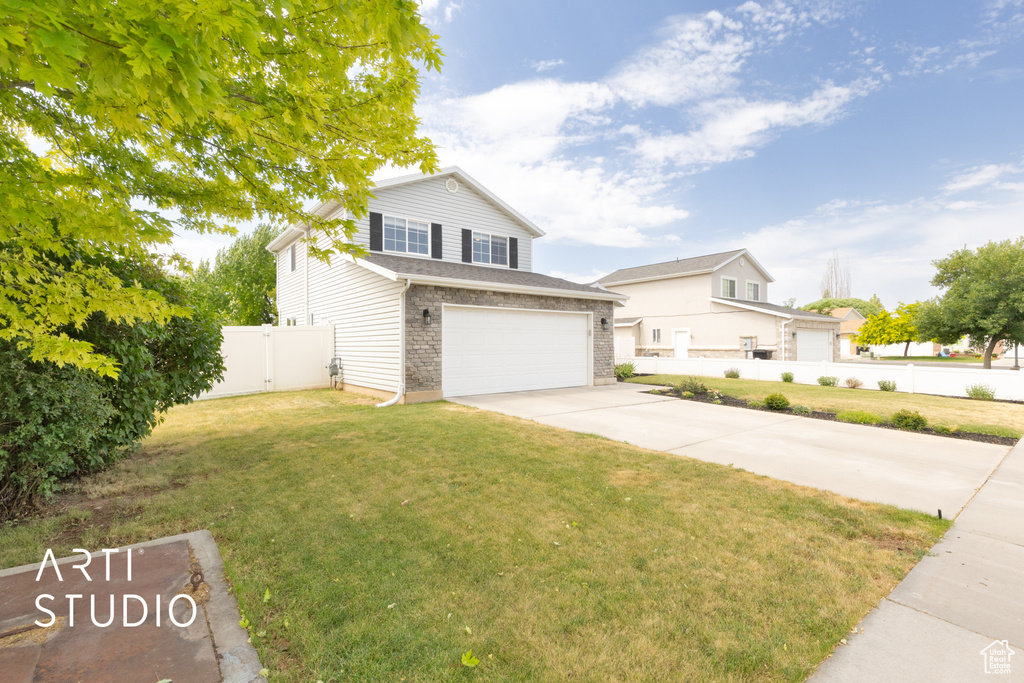 Traditional-style home with concrete driveway and a garage