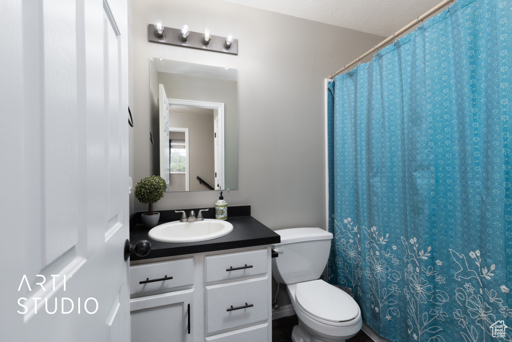 Full bathroom with vanity and a shower with curtain