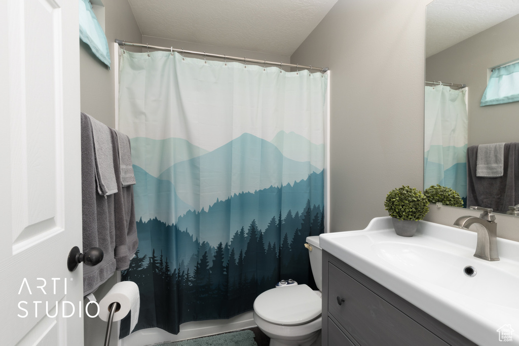 Bathroom with vanity and a shower with shower curtain