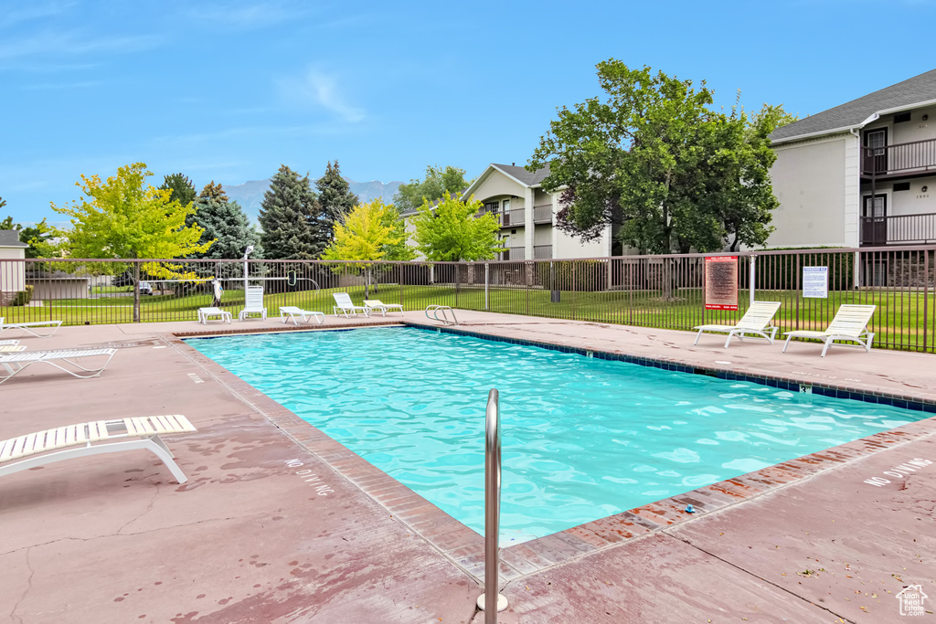 Community pool with a patio area