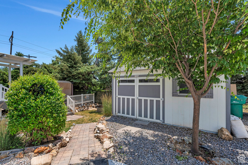 Garage featuring a storage shed