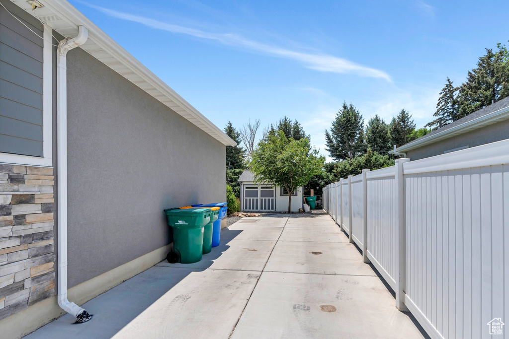 View of patio with an outbuilding