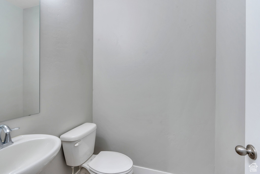 Bathroom featuring a sink and toilet