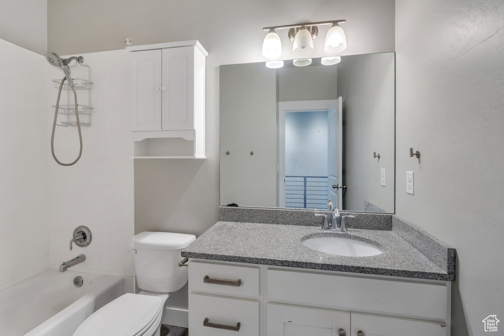 Full bathroom featuring vanity and washtub / shower combination