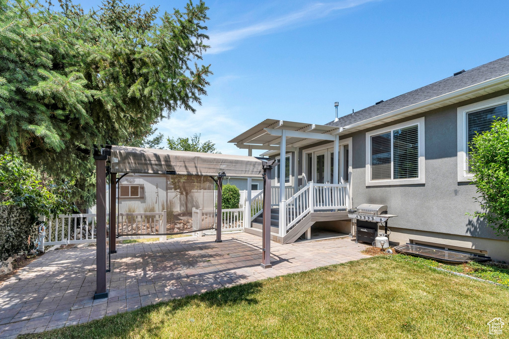 View of yard featuring a patio area and a pergola