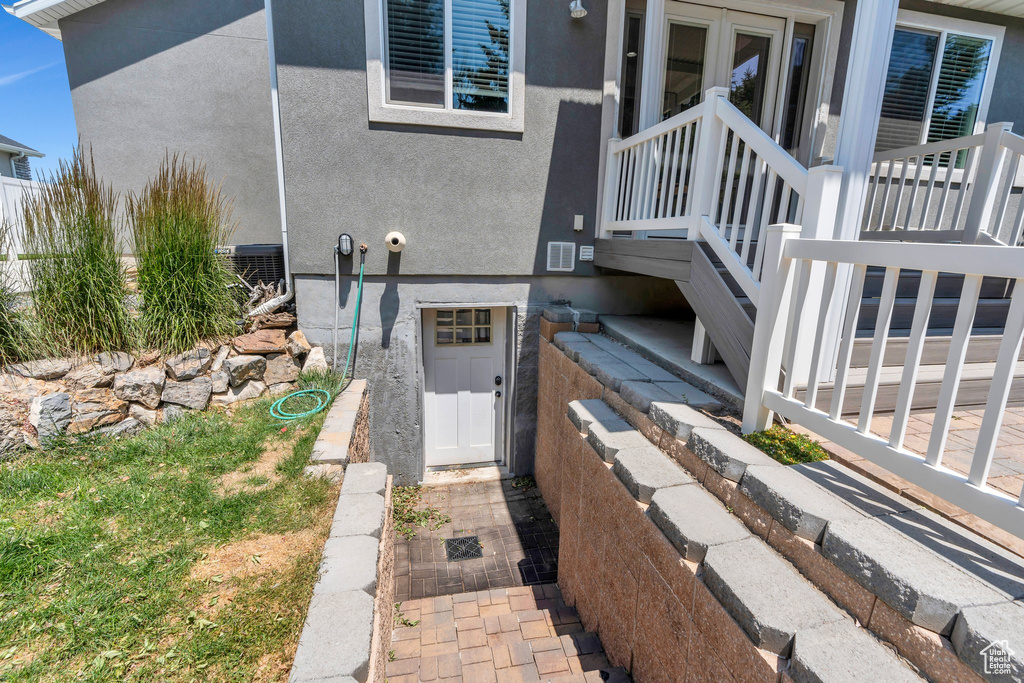 Property entrance featuring stucco siding