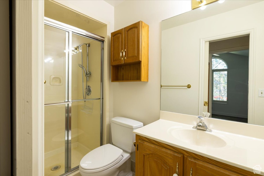 Bathroom with vanity and a stall shower