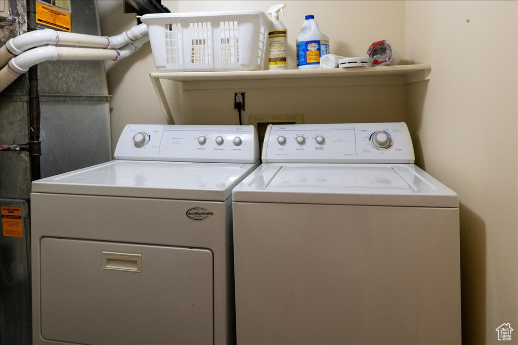 Washroom featuring washer and clothes dryer