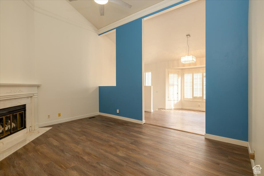 Unfurnished living room with ceiling fan, a fireplace, dark wood-style floors, and high vaulted ceiling