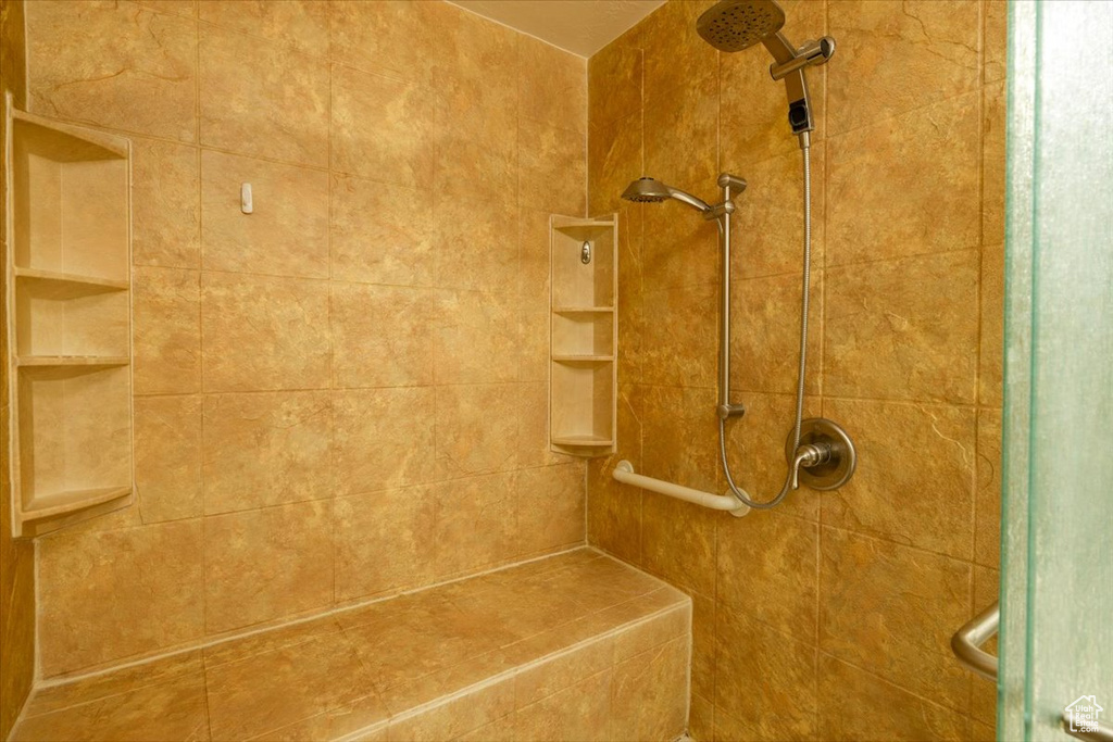 Full bathroom featuring tiled shower