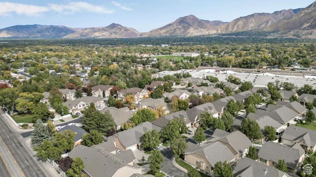 Aerial perspective of suburban area with a mountainous background