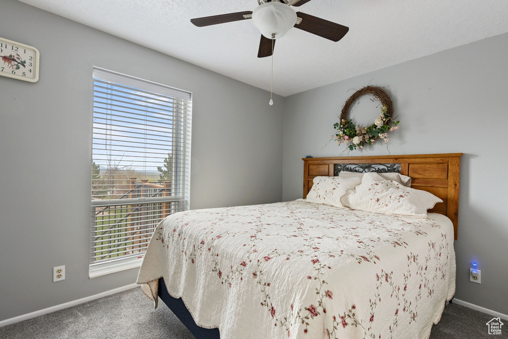 Bedroom featuring carpet flooring and ceiling fan