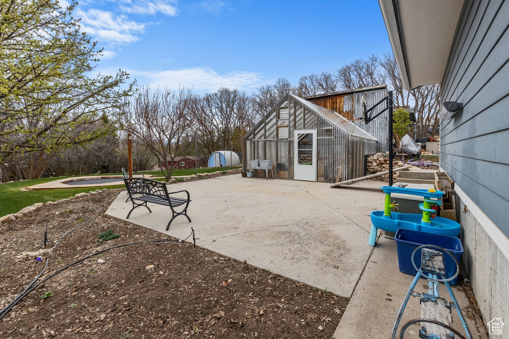 View of patio with an outdoor structure