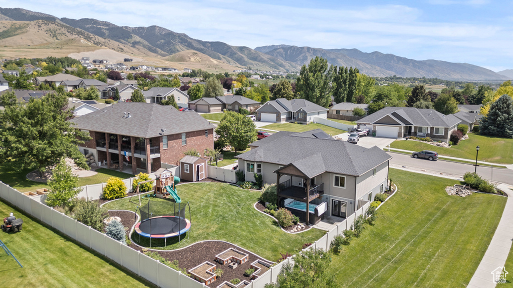 Aerial perspective of suburban area featuring a mountainous background