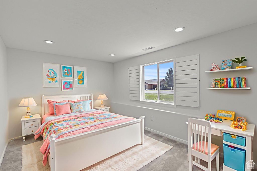 Carpeted bedroom with baseboards and recessed lighting