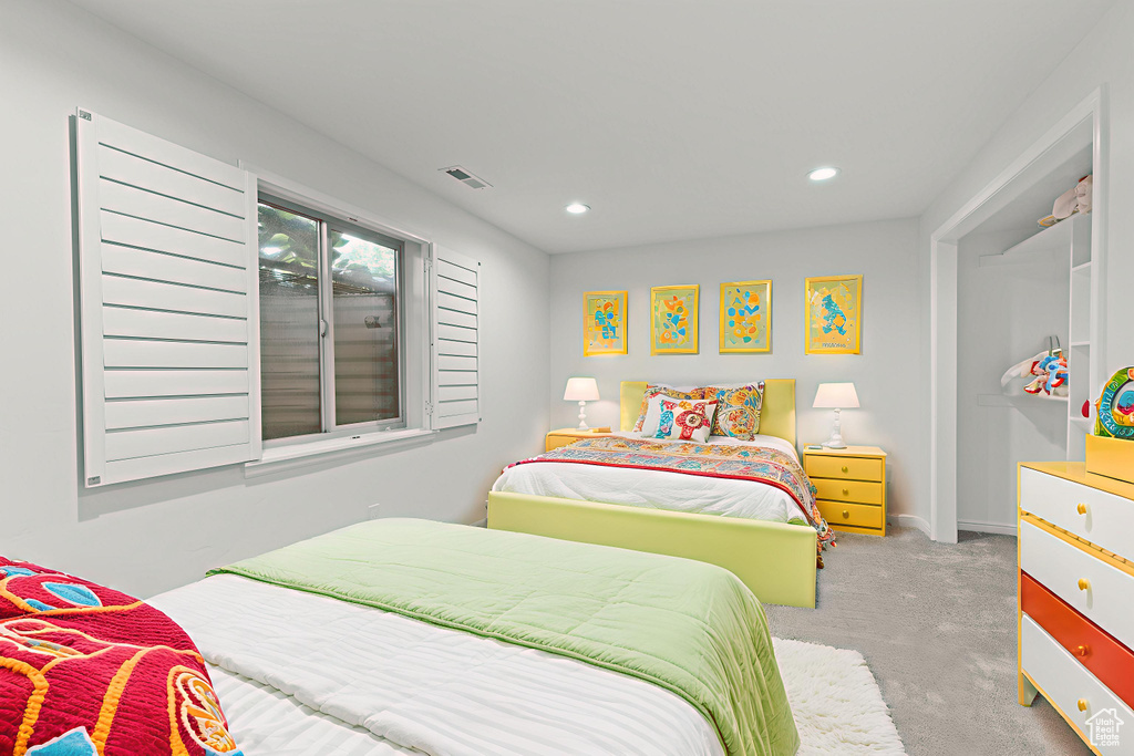 Bedroom with carpet flooring and recessed lighting