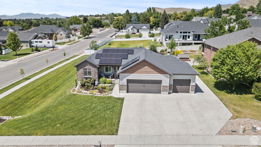 Aerial perspective of suburban area featuring a mountainous background