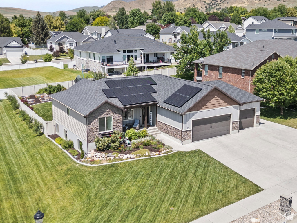 Aerial perspective of suburban area with a mountain backdrop